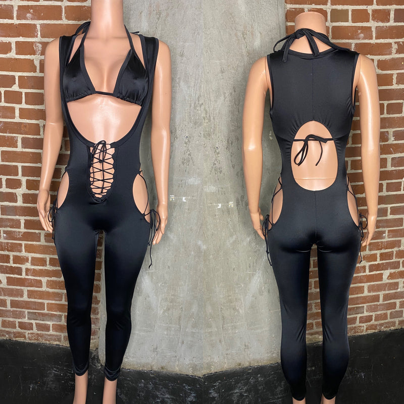Sleeveless lace up stomach jumpsuit with open back and lace up hips. Matching bikini top.